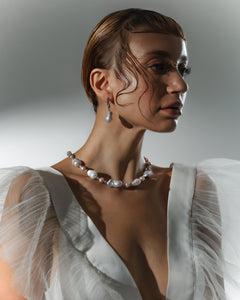 Editorial bridal portrait featuring baroque pearl necklace and matching drop earrings — Mayfair Pearls jewellery set