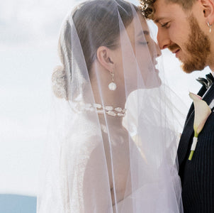 Contemporary baroque pearl earrings with gold drop detail, part of Mayfair Pearls’ bridal collection
