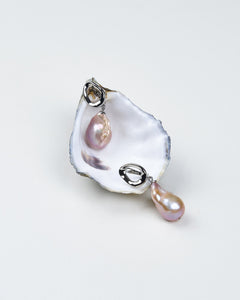 A pair of silver abstract clasp pink baroque teardrop earrings on a white background. Perfect gift for her. 